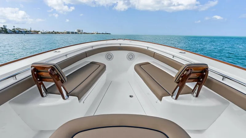 Slide: The Image of Spacious Forward Seating Area The forward seating area of the 2024 Valhalla Boatworks V-37 offers plush, upholstered benches with elegant wooden backrests. Perfect for relaxation, this space provides panoramic views of the water, enhancing the cruising experience. The sleek design and - 7471186