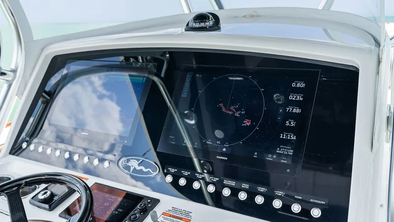 Slide: The Image of Helm Station with Dual Displays The helm station of the 2024 Valhalla V-37 features state-of-the-art dual displays, offering comprehensive navigation and system controls. The sleek, modern dashboard is equipped with user-friendly interfaces, ensuring ease of operation while at sea. The - 7471206