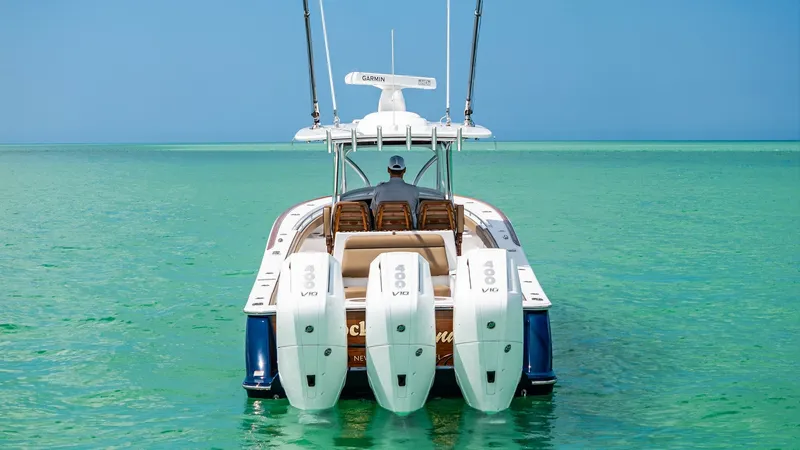 Slide: The Image of Aft View with Triple Engines Showcasing the powerful triple-engine configuration, the V-37 by Valhalla Boatworks offers exceptional performance and speed. The sleek aft design complements the vibrant blue hull, while the spacious seating area ensures comfort and style. Ideal for both - 7471224