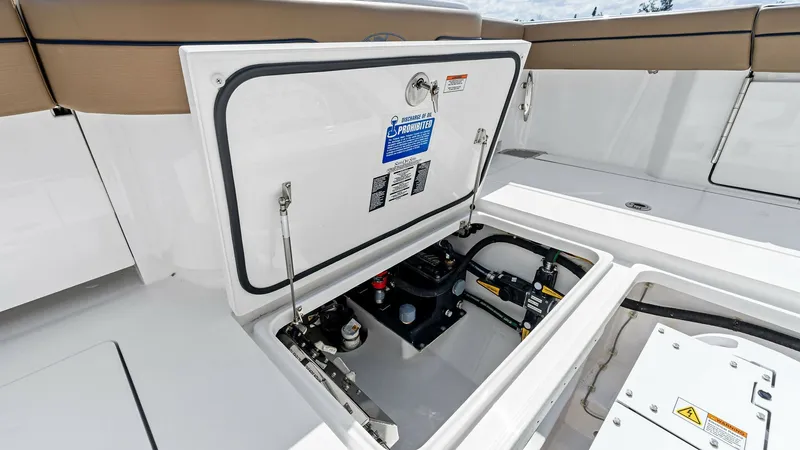 Slide: The Image of Aft Deck Storage Compartment This image showcases the aft deck storage compartment of the 2024 Valhalla V-37. The compartment is neatly organized, providing easy access to essential equipment and systems. The sleek design and durable materials ensure functionality and longevity, enha - 7471181