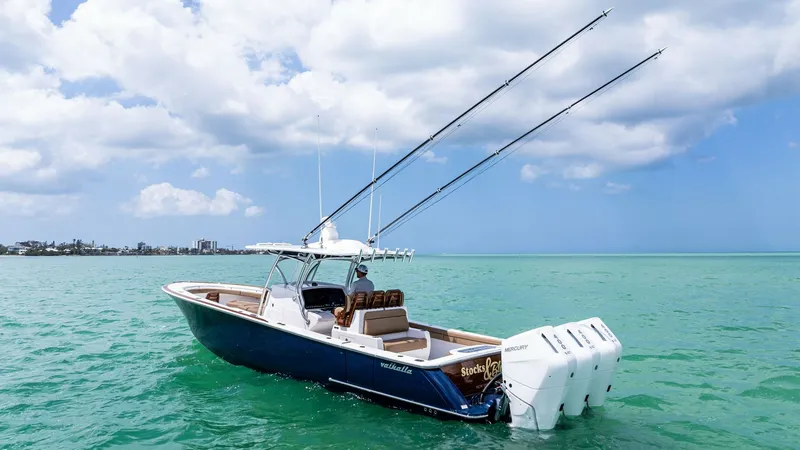 Slide: The Image of Aft View with Triple Engines The 2024 Valhalla V-37 'BIRD' showcases a sleek aft view, highlighting its powerful triple Mercury engines for superior performance. The spacious cockpit provides ample seating with plush, weather-resistant upholstery, perfect for both fishing and leisure - 7471230
