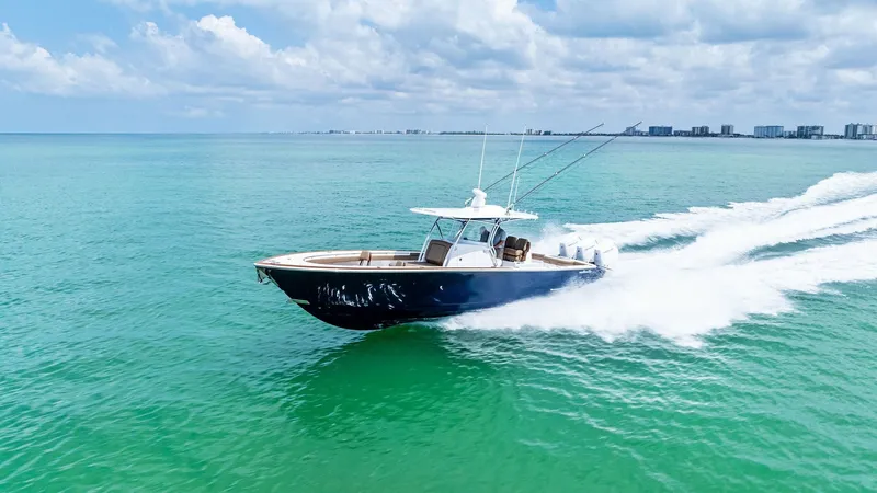 Slide: The Image of V-37 Cruising at Sea The V-37 by Valhalla Boatworks glides effortlessly across the vibrant turquoise waters, showcasing its sleek design and powerful performance. The vessel's aerodynamic hull and advanced engineering enable smooth navigation and impressive speed. Ideal for b - 7471238