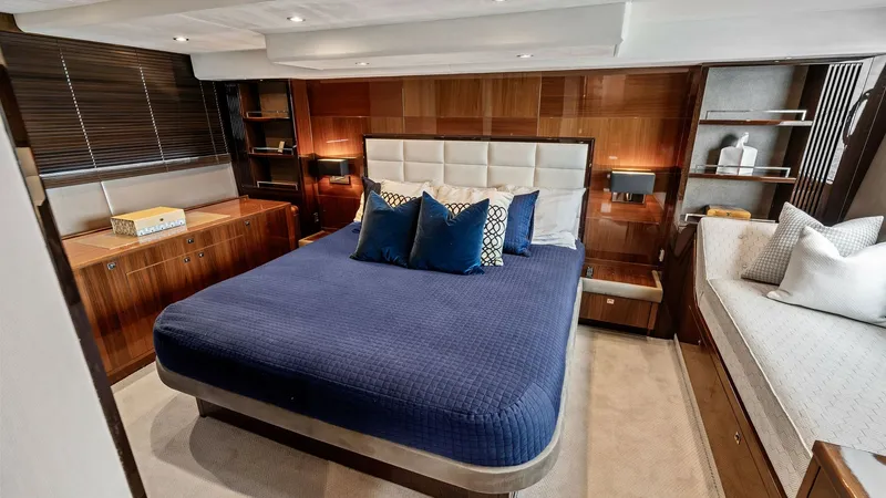 Slide: The Image of Master Stateroom with Queen Bed The master stateroom offers a luxurious queen-sized bed adorned with plush pillows, creating a serene retreat. Rich wood finishes and soft ambient lighting enhance the elegant atmosphere. Ample storage and a cozy seating area add to the functionality and - 7460822