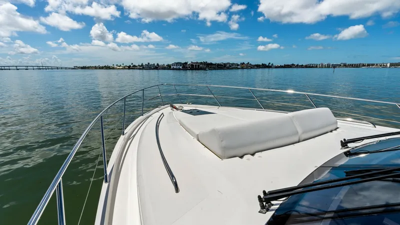 Slide: The Image of Bow Sunbathing Area with Cushions Experience ultimate relaxation on the spacious bow of the 2016 Princess 64 Flybridge. This area features plush sunbathing cushions, perfect for soaking up the sun while enjoying panoramic views of the surrounding waters. The sleek railings and clean lines - 7460868