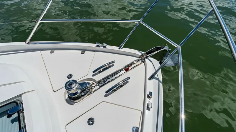 Slide: The Image of Bow Anchor System The bow of the 2016 Princess 64 Flybridge features a robust anchor system, complete with a polished stainless steel windlass and chain. The sleek, clean design of the deck provides functionality and aesthetic appeal, while the sturdy railings offer safety - 7460865