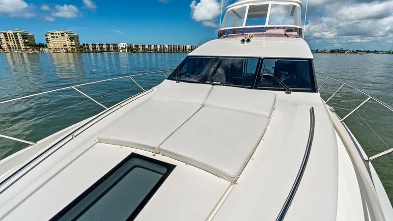 Slide: The Image of Spacious Forward Deck with Sunpads Experience luxury and relaxation on the forward deck of the 2016 Princess 64 Flybridge. This area features expansive sunpads, perfect for soaking up the sun while enjoying panoramic views. The sleek design and clean lines enhance both the aesthetic appeal - 7460867