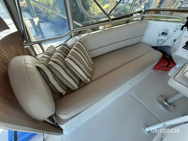 Slide: The Image of 39' Mainship flybridge port seating - 7459916