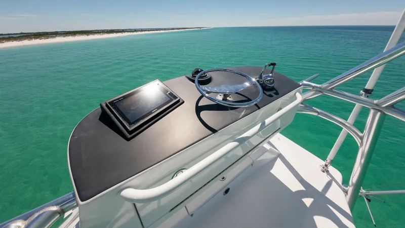 Slide: The Image of Flybridge Helm with Ocean View The flybridge helm of the 2006 Blackwell 65 Convertible showcases a sleek, modern design with state-of-the-art navigation equipment. The stainless steel wheel and controls provide a commanding view of the open ocean, enhancing the vessel's allure for adve - 7469779