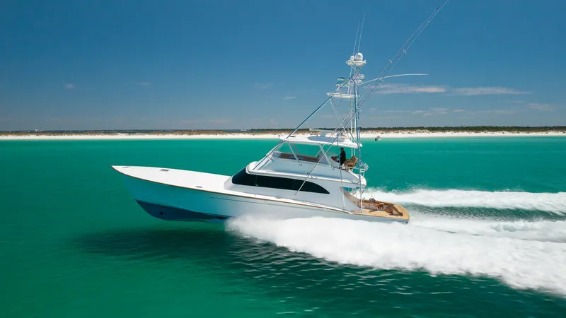 The Image of Side View of Blackwell 65 Convertible This striking side view captures the sleek lines and powerful presence of the 2006 Blackwell 65 Convertible, MAE. The vessel glides effortlessly through turquoise waters, showcasing its robust hull and elegant profile. Its towering structure and spacious - 7469743