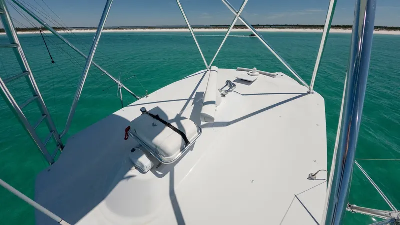 Slide: The Image of Flybridge with Open Ocean View The flybridge on the 2006 Blackwell 65 Convertible offers a commanding view of the surrounding turquoise waters. With a sleek, uncluttered design, this space provides an ideal vantage point for navigation or relaxation. The robust framework and clear line - 7469782
