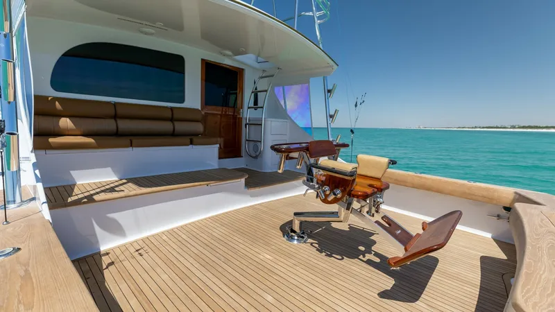 Slide: The Image of Spacious Aft Deck with Fishing Chair The aft deck of the 2006 Blackwell 65 Convertible features a beautifully finished teak flooring that complements the open sea views. A comfortable bench seat and a professional-grade fishing chair make this space ideal for both relaxation and sport fishin - 7469790