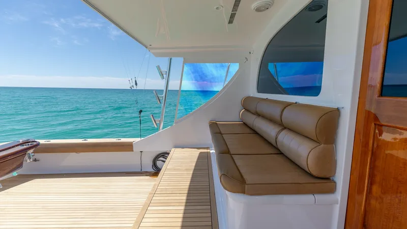 Slide: The Image of Spacious Aft Deck with Seating The aft deck of the 2006 Blackwell 65 Convertible offers a generous seating area with plush, tan cushions, perfect for relaxation or entertaining. The teak flooring adds a touch of elegance and durability, while the open layout provides stunning ocean vie - 7469785