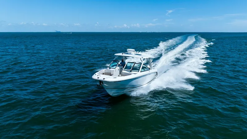 Slide: The Image of Dynamic Bow View in Motion The 2019 Boston Whaler 320 Vantage 'Thou Shell Knot' glides effortlessly across open waters, showcasing its sleek hull design and robust performance. The bow cuts through the waves with precision, highlighting the vessel's superior engineering and craftsm - 7469866