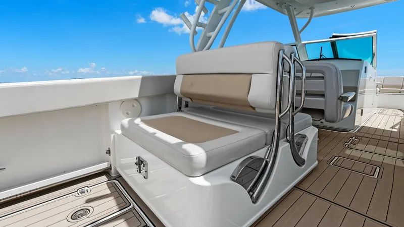 Slide: The Image of Cockpit Seating Area The cockpit of the 2019 Boston Whaler 320 Vantage, featuring a sleek and comfortable seating arrangement. The cushioned seats offer ample space and support, ideal for socializing or relaxing while underway. The high-quality finishes and durable materials - 7469829