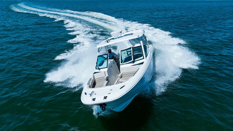 Slide: The Image of Dynamic Bow View on Open Water Experience the thrill of the 2019 Boston Whaler 320 Vantage as it gracefully cuts through the waves. This image captures the sleek bow design and spacious dual console layout, perfect for both adventure and relaxation. The open helm offers excellent visib - 7469862