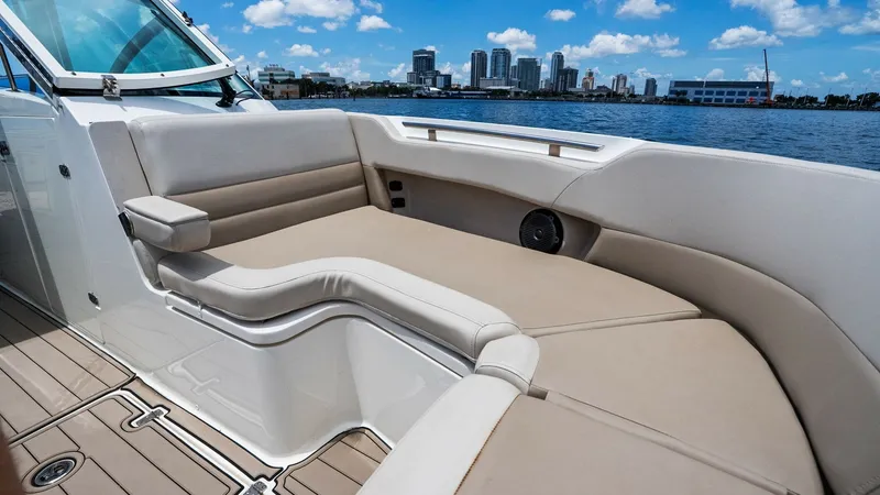 Slide: The Image of Spacious Aft Lounge Seating The aft lounge area on the 2019 Boston Whaler 320 Vantage offers luxurious comfort with its plush, wraparound seating. Designed for relaxation, the soft upholstery and ample space invite you to unwind while enjoying picturesque waterfront views. The area - 7469832