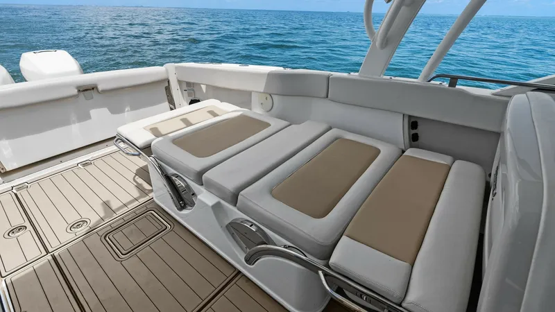Slide: The Image of Spacious Aft Deck with Loungers The aft deck of the 2019 Boston Whaler 320 Vantage features plush, adjustable loungers perfect for relaxation. The seating is complemented by elegant, durable flooring and a sleek, modern design. Enjoy the open views of the surrounding waters, making it a - 7469826