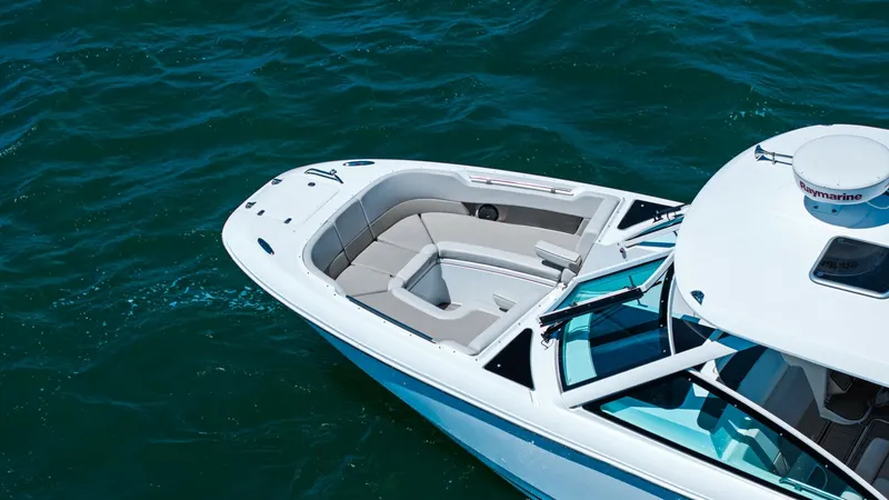 Slide: The Image of Bow Seating Area The Boston Whaler 320 Vantage features a spacious bow seating area, perfect for relaxing and enjoying the view. The plush, cushioned seats offer comfort, while the sleek design ensures a stylish look. This area is ideal for socializing, with ample space a - 7469852