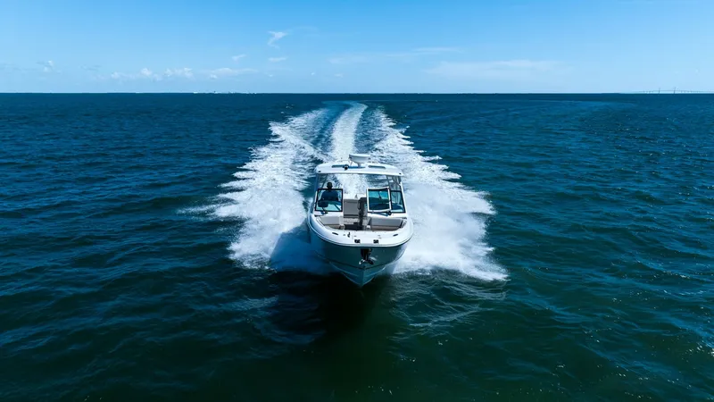Slide: The Image of Dynamic Bow View at Sea Experience the thrill of open water with the 2019 Boston Whaler 320 Vantage, as it cuts through the waves with precision. The sleek design and powerful performance are evident, showcasing its robust hull and dynamic presence. Perfect for adventure seekers - 7469865