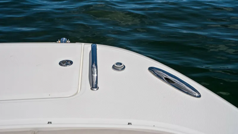 Slide: The Image of Bow Deck with Cleat and Hatch The bow deck of the 2019 Boston Whaler 320 Vantage features a sleek cleat and an access hatch, providing both functionality and style. The smooth, non-slip surface ensures safety while the polished stainless steel elements enhance the vessel's aesthetic a - 7469834