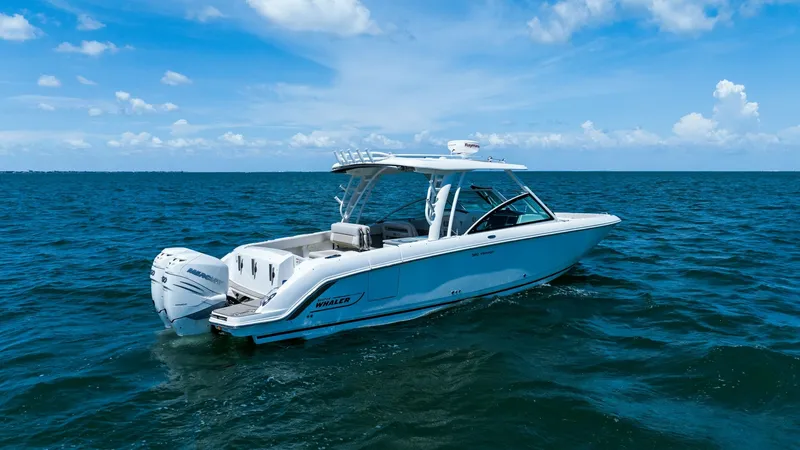 Slide: The Image of Aft View with Twin Engines The 2019 Boston Whaler 320 Vantage showcases its sleek design with a spacious aft deck, ideal for leisure and fishing activities. Twin engines provide powerful performance, while the sturdy T-top offers shade and protection. The elegant lines and premium - 7469859