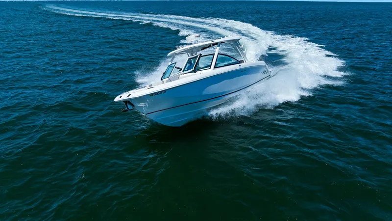 Slide: The Image of Dynamic Bow View in Motion The 2019 Boston Whaler 320 Vantage cuts through the water with impressive agility, showcasing its sleek, powerful bow design. The vessel glides effortlessly, highlighting its robust construction and advanced engineering. Crisp white hull contrasts beautif - 7469863