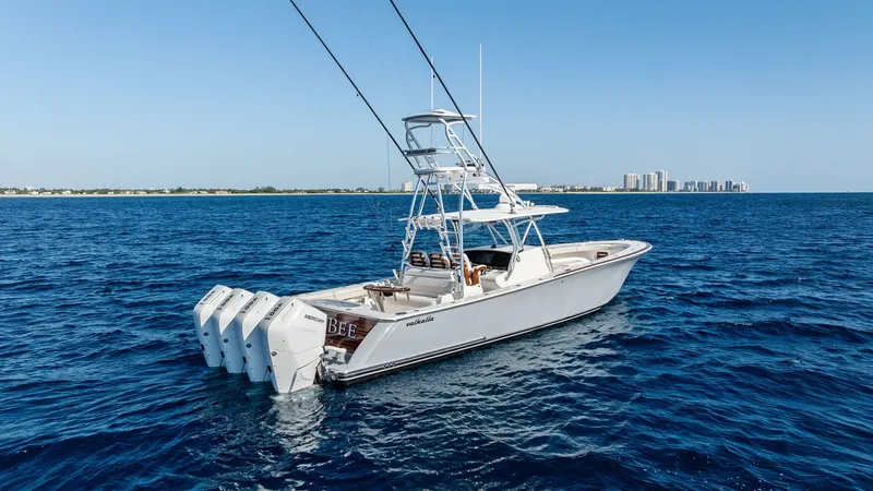 Slide: The Image of Aft View with Quad Engines This image showcases the aft view of the Annabee, a 2025 Valhalla Boatworks V-41. The vessel is equipped with four powerful outboard engines, emphasizing its performance capabilities. The sleek design and spacious deck offer a perfect blend of luxury and - 7517274