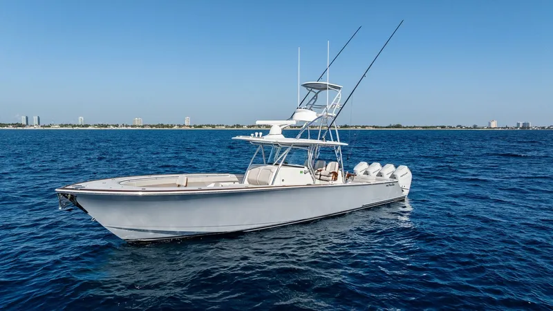 Slide: The Image of Starboard Profile with Tower View The 2025 Valhalla Boatworks V-41, vessel Annabee, is showcased with its sleek starboard profile against a serene ocean backdrop. The impressive tower provides an elevated vantage point, ideal for spotting fish or enjoying panoramic views. Equipped with po - 7517272