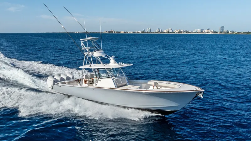 The Image of Side Profile of Sportfishing Yacht This image showcases the sleek side profile of the 2025 Valhalla Boatworks V-41. With powerful quad outboard engines, the vessel effortlessly cuts through the water, offering both speed and stability. The spacious deck and elevated tower provide excellent - 7517241
