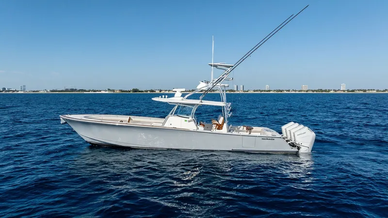 Slide: The Image of Side Profile of Valhalla V-41 This image showcases the sleek side profile of the 2025 Valhalla V-41 manufactured by Valhalla Boatworks. The vessel features a modern design with a spacious deck and a robust triple-engine setup for enhanced performance. Its elegant lines and advanced fi - 7517273