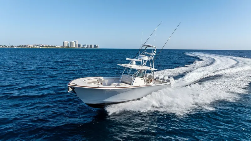 Slide: The Image of V-41 Center Console in Motion The 2025 Valhalla V-41, 'Annabee', showcases its sleek design and powerful performance as it slices through the water. The center console layout offers excellent visibility and control, while the streamlined hull ensures a smooth, efficient ride. Perfectl - 7517278