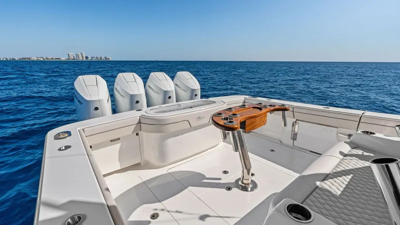 Slide: The Image of Aft Deck with Fishing Setup The aft deck of the 2025 Valhalla V-41 features a spacious layout designed for both leisure and sport. Equipped with a sleek, functional fishing station and rod holders, it caters to avid anglers. The seating area offers comfortable, diamond-stitched upho - 7517259