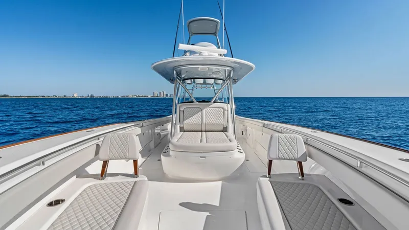 Slide: The Image of Spacious Forward Deck Seating Area The forward deck of the 2025 Valhalla V-41 showcases luxurious and expansive seating, perfect for relaxing while cruising. The diamond-stitched upholstery and ergonomic design offer both comfort and style, enhancing the vessel's aesthetic appeal. Surround - 7517243