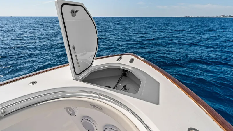 Slide: The Image of Bow Anchor Locker Access This image showcases the bow anchor locker of the 2025 Valhalla V-41. The sleek design features a convenient hatch providing easy access to the anchor system, ensuring seamless operation while at sea. The clean lines and durable materials reflect Valhalla - 7517249