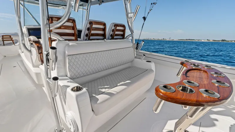 Slide: The Image of Cockpit Seating and Helm Station The Annabee's cockpit features plush, diamond-stitched seating, providing comfort and style on the open water. The helm station is equipped with ergonomically designed chairs and state-of-the-art controls, ensuring a smooth and enjoyable navigation experi - 7517257