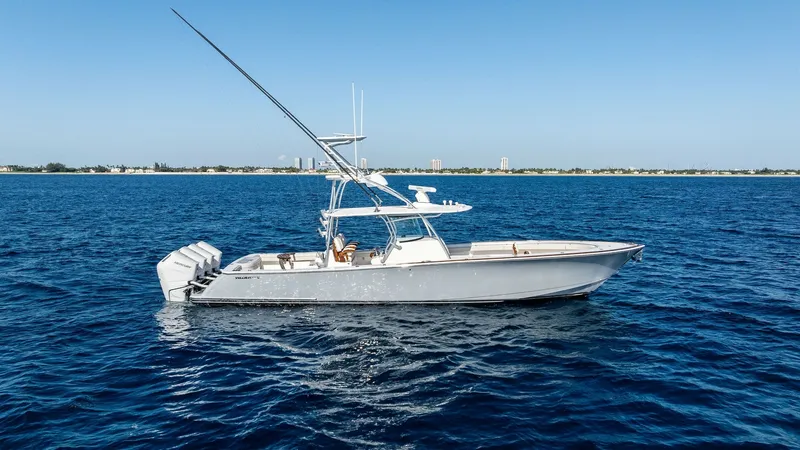 Slide: The Image of Side Profile of Valhalla V-41 The 2025 Valhalla V-41 by Valhalla Boatworks showcases a sleek and powerful design, ideal for offshore adventures. This side profile highlights its robust hull and the advanced quad outboard engines, ensuring exceptional speed and performance. The clean l - 7517269