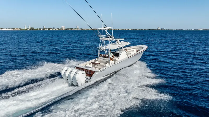 Slide: The Image of Aft View with Triple Outboards This dynamic aft view showcases the Annabee's powerful triple outboard engines, propelling the Valhalla V-41 through the open waters. The sleek design and spacious deck are ideal for both fishing and leisure, reflecting the craftsmanship of Valhalla Boatw - 7517279
