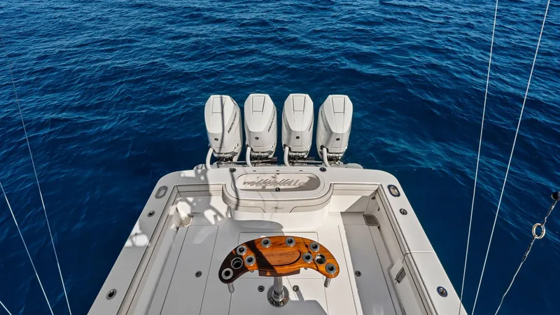 Slide: The Image of Aft Deck with Quad Outboards The aft deck of the Valhalla V-41 showcases a powerful setup with four sleek outboard engines, perfect for high-speed cruising. The spacious fishing area is equipped with a high-quality teak fighting chair, emphasizing the vessel's sportfishing capabiliti - 7517267