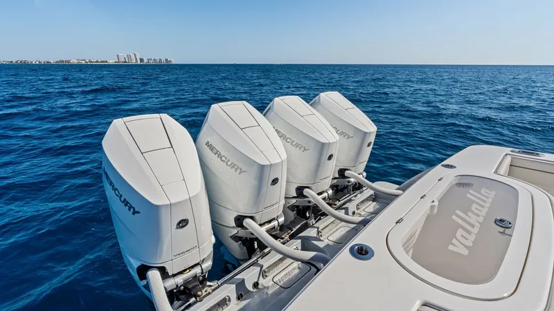 Slide: The Image of Powerful Quad Outboard Engines The Annabee's stern showcases four robust Mercury outboard engines, highlighting the vessel's impressive power and performance capabilities. The sleek design of the engines complements the Valhalla Boatworks V-41 model's modern aesthetics. The spacious de - 7517261