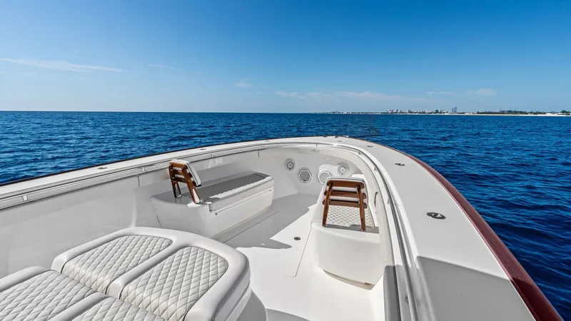 Slide: The Image of Spacious Bow Seating Area The bow of the 2025 Valhalla V-41 features luxurious quilted seating, perfect for relaxation and enjoying the open sea views. The area is designed for comfort with plush cushions and sleek white finishes. Ideal for social gatherings, the bow offers ample - 7517246