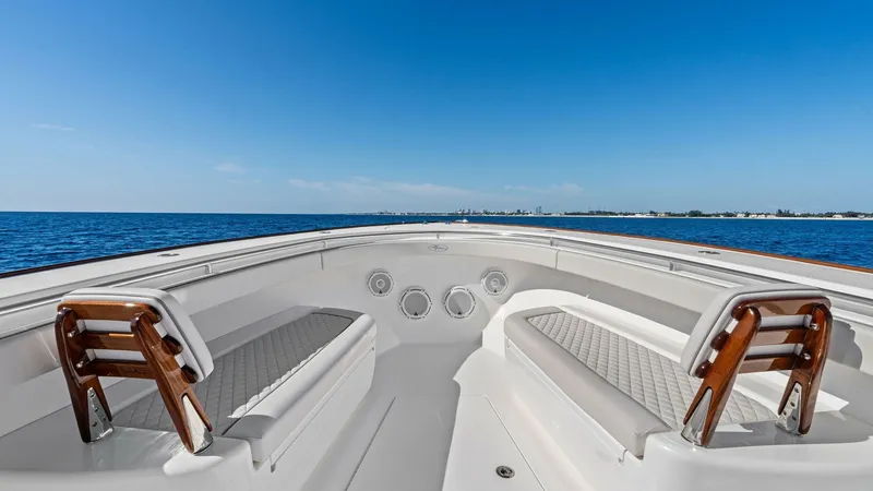 Slide: The Image of Spacious Bow Seating Area The Valhalla V-41's bow offers a spacious seating area, perfect for relaxation while enjoying panoramic ocean views. Equipped with comfortable, upholstered benches and stylish wooden accents, this area combines luxury with functionality. The clean, sleek - 7517247
