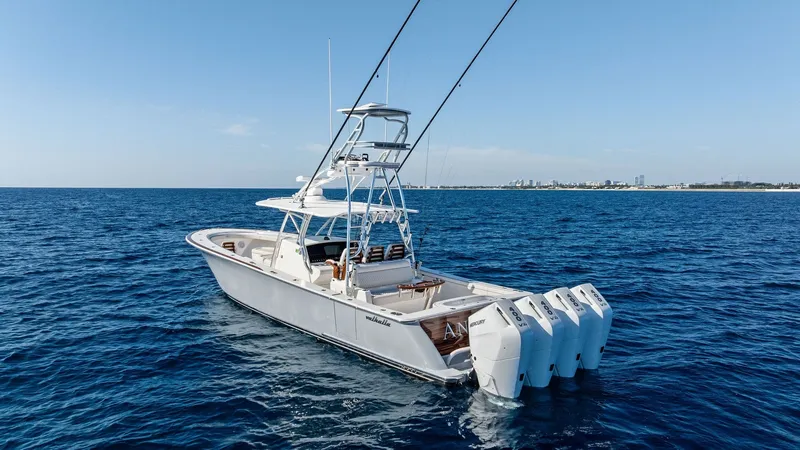 Slide: The Image of Aft Deck with Quad Outboards This image showcases the sleek aft deck of the 2025 Valhalla Boatworks V-41, featuring powerful quad outboard engines for superior performance. The spacious deck offers ample seating and a robust T-top for shade and functionality, ideal for both leisure a - 7517276
