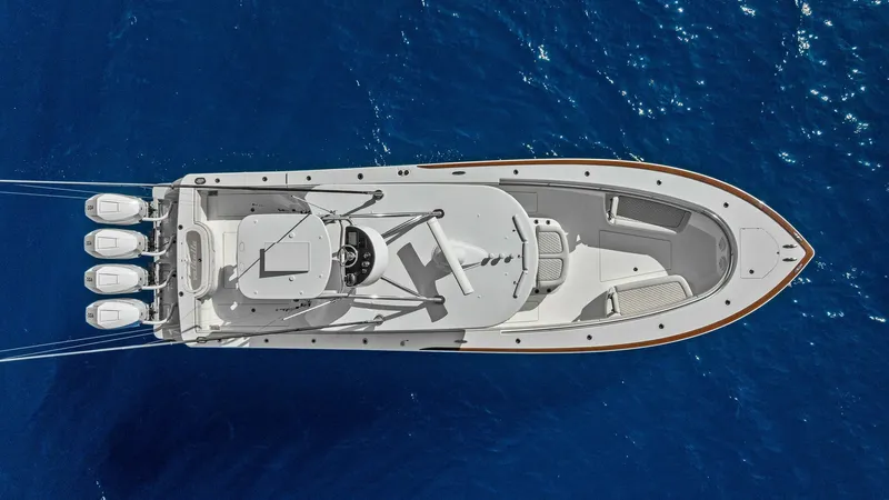 Slide: The Image of Aerial View of V-41 Deck Layout This aerial image of the 2025 Valhalla Boatworks V-41 showcases its sleek and streamlined deck layout. The spacious bow provides ample seating and lounging space, while the center console is equipped with state-of-the-art navigation and control systems. T - 7517268