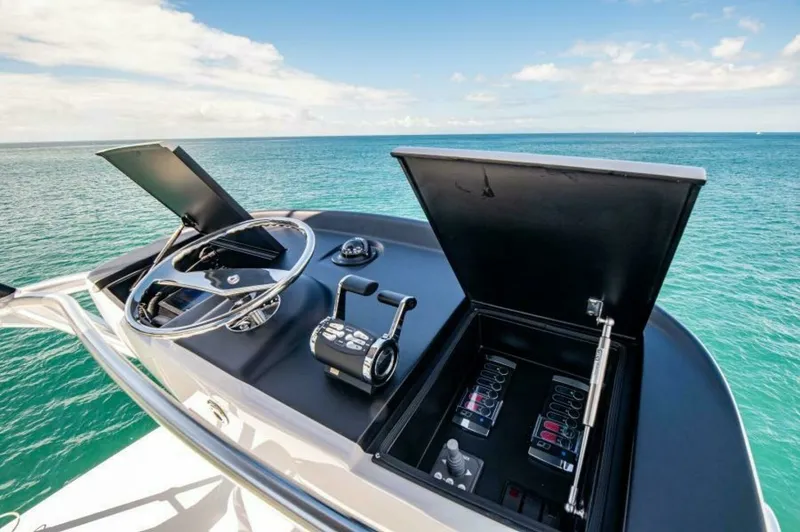 Slide: The Image of Flybridge Helm Station with Electronics The flybridge helm station of the 2023 Viking 64 Convertible offers a sleek, modern design equipped with state-of-the-art electronics. Featuring dual control levers and an advanced navigation system, it provides superior handling and precision. The open s - 7530870