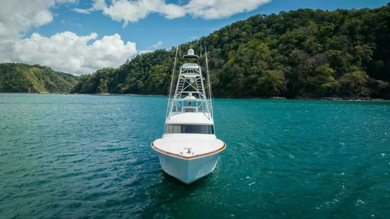 Slide: The Image of Bow View with Tower The 2023 Viking 64 Convertible 'Twin Reels' is captured from the bow, showcasing its sleek lines and commanding presence on the water. The image highlights the vessel's impressive tower, designed for optimal visibility and enhanced fishing capabilities. S - 7530883