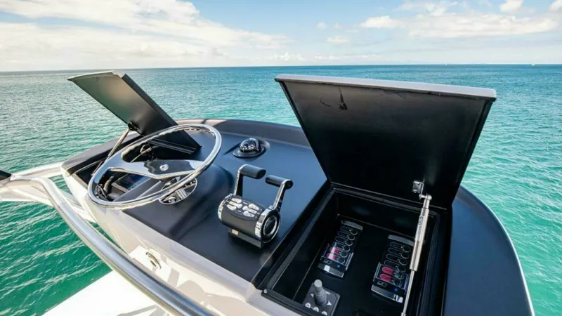 Slide: The Image of Flybridge Helm Station with Electronics The flybridge helm station of the 2023 Viking 64 Convertible offers a sleek, modern design equipped with state-of-the-art electronics. Featuring dual control levers and an advanced navigation system, it provides superior handling and precision. The open s - 7600552