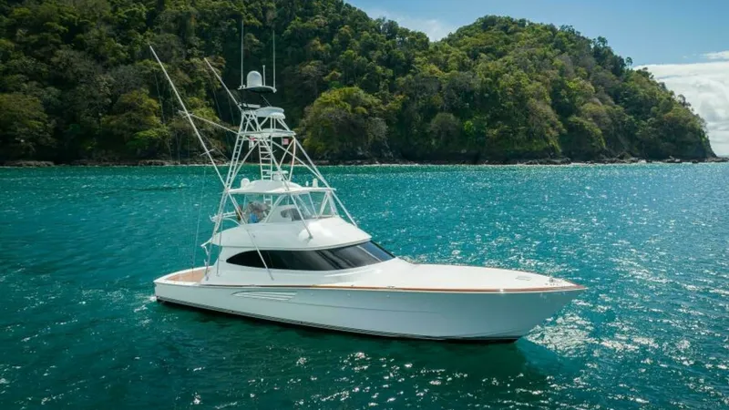 The Image of Side Profile of Viking 64 Convertible The 2023 Viking 64 Convertible 'Twin Reels' is showcased in its natural element, highlighting its sleek hull and sophisticated lines. The vessel's tower and aerodynamic superstructure are designed for optimal performance and visibility. This model combine - 7600504