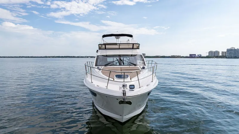 Slide: The Image of Bow View with Flybridge This stunning bow view of the 2018 Sea Ray 400 Fly showcases its sleek lines and modern design. The spacious flybridge offers panoramic views, perfect for enjoying the open water. The yacht's elegant exterior features a streamlined hull and polished stain - 7762721