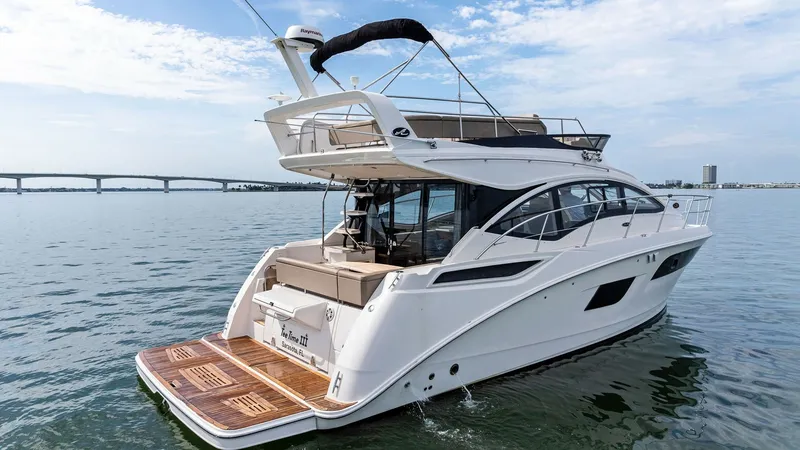 Slide: The Image of Aft Deck and Swim Platform The aft deck of the 2018 Sea Ray 400 Fly features a spacious swim platform, perfect for easy water access. The elegant design is complemented by sleek lines and ample seating, ideal for entertaining or relaxing. With its elevated flybridge and luxurious f - 7762731