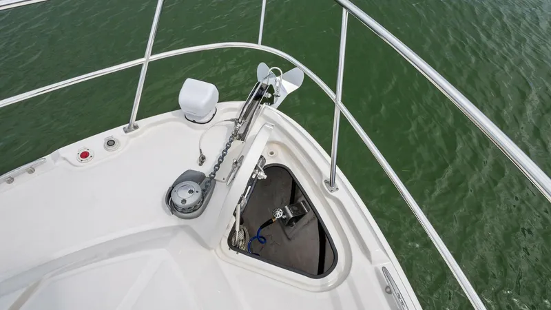 Slide: The Image of Bow Anchor System This image showcases the robust anchor system on the bow of the 2018 Sea Ray 400 Fly, Tee Time III. The stainless steel railings provide safety and durability, while the windlass ensures easy anchor deployment and retrieval. The spacious design allows for - 7762748